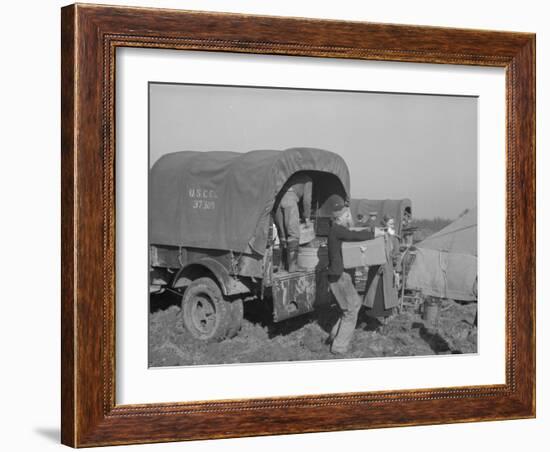 Unloading the goods of a family being moved into the camp for refugees at Forrest City, Arkansas-Walker Evans-Framed Photographic Print