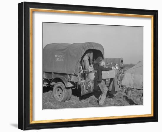 Unloading the goods of a family being moved into the camp for refugees at Forrest City, Arkansas-Walker Evans-Framed Photographic Print