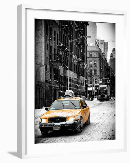 Urban Street Scene with a Yellow Taxi in Snow-Philippe Hugonnard-Framed Photographic Print