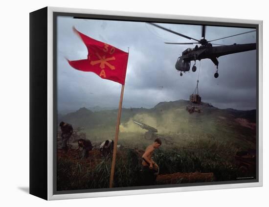 US 1st Air Cavalry Skycrane Helicopter Delivering Ammunition and Supplies to Besieged Marines-Larry Burrows-Framed Premier Image Canvas