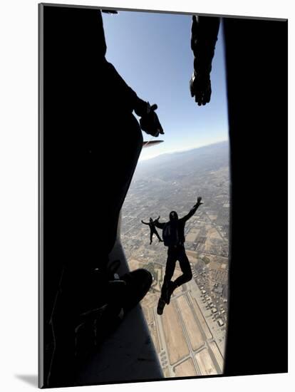 US Air Force Academy Parachute Team Jumps Out of an Aircraft over Nellis Air Force Base, Nevada-null-Mounted Photographic Print