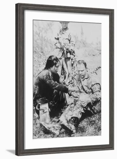 US Air Force Pilot Is Given First Aid by North Vietnam Captors in Jan. 1966-null-Framed Photo