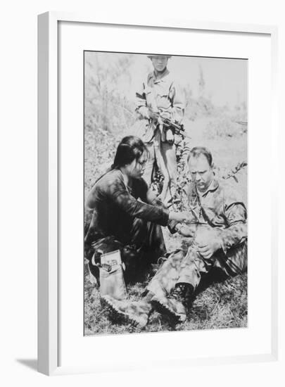 US Air Force Pilot Is Given First Aid by North Vietnam Captors in Jan. 1966-null-Framed Photo