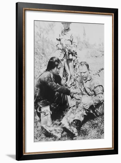 US Air Force Pilot Is Given First Aid by North Vietnam Captors in Jan. 1966-null-Framed Photo