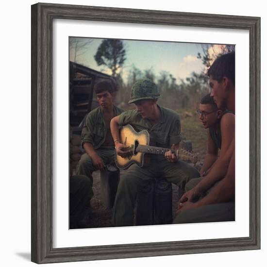 US Army Infantrymen Gather around a Guitar Player and Sing, Vietnam, Jan. 1968-null-Framed Photo