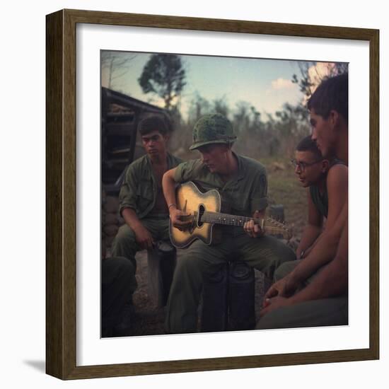 US Army Infantrymen Gather around a Guitar Player and Sing, Vietnam, Jan. 1968-null-Framed Photo