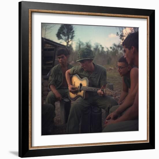 US Army Infantrymen Gather around a Guitar Player and Sing, Vietnam, Jan. 1968-null-Framed Photo