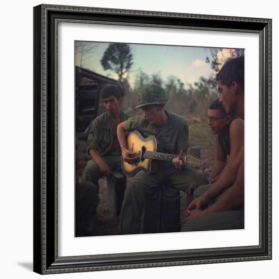 US Army Infantrymen Gather around a Guitar Player and Sing, Vietnam, Jan. 1968-null-Framed Photo