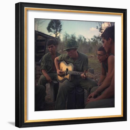 US Army Infantrymen Gather around a Guitar Player and Sing, Vietnam, Jan. 1968-null-Framed Photo