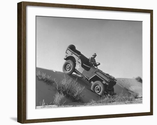 US Army Jeep Rolling Down a Sand Dune During Training Maneuvers in the Desert-null-Framed Photographic Print