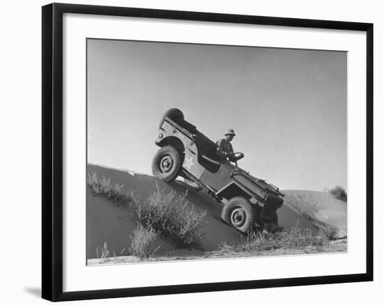 US Army Jeep Rolling Down a Sand Dune During Training Maneuvers in the Desert-null-Framed Photographic Print