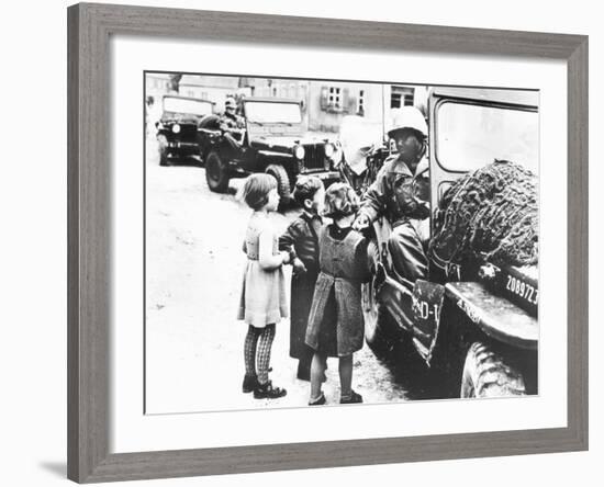 Us Army Soldier Greeting Children with Sweets, Germany, 1945-null-Framed Photographic Print