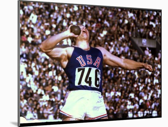 US Athlete in Action During the Shot Put at the Summer Olympics-John Dominis-Mounted Photographic Print