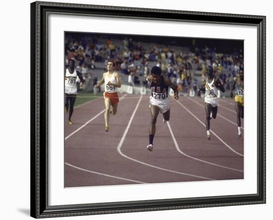 US Athlete Lee Evans Going Through Finish Line During Race at Summer Olympics-null-Framed Premium Photographic Print