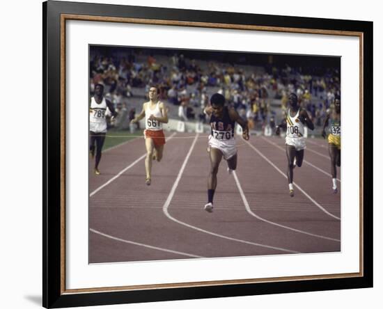 US Athlete Lee Evans Going Through Finish Line During Race at Summer Olympics-null-Framed Premium Photographic Print