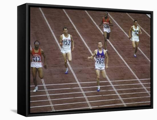 US Athlete Michael Larrabee Winning the 400 Meters at the Summer Olympics-George Silk-Framed Premier Image Canvas