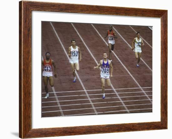 US Athlete Michael Larrabee Winning the 400 Meters at the Summer Olympics-George Silk-Framed Premium Photographic Print