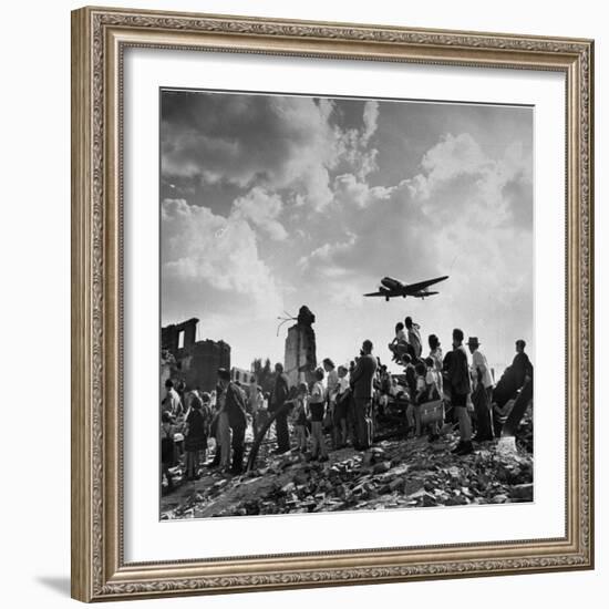 US C-47 Cargo Plane Flying over Ruins, Approaching Tempelhof Airport with Food and Supplies-Walter Sanders-Framed Photographic Print