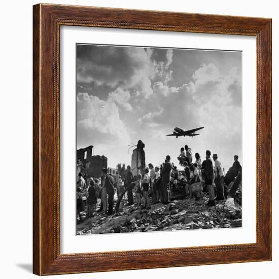 US C-47 Cargo Plane Flying over Ruins, Approaching Tempelhof Airport with Food and Supplies-Walter Sanders-Framed Photographic Print