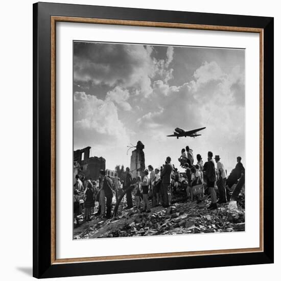 US C-47 Cargo Plane Flying over Ruins, Approaching Tempelhof Airport with Food and Supplies-Walter Sanders-Framed Photographic Print