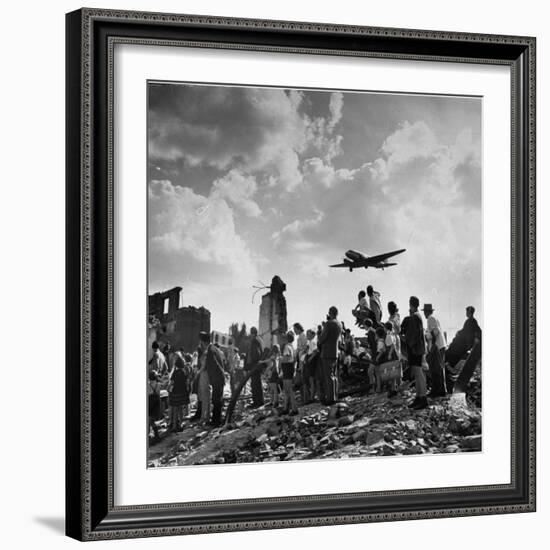 US C-47 Cargo Plane Flying over Ruins, Approaching Tempelhof Airport with Food and Supplies-Walter Sanders-Framed Photographic Print