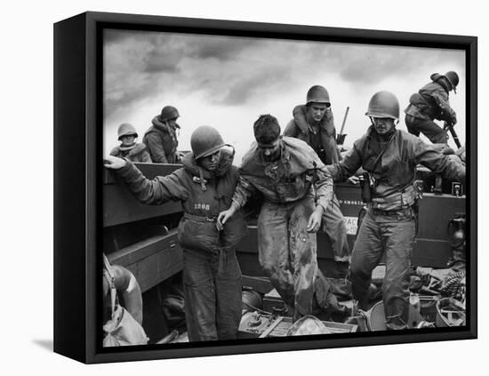 US Coast Guardsmen Assisting a Wounded Marine Returning from the Fight on Iwo Jima-null-Framed Premier Image Canvas