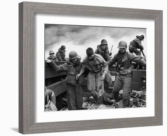 US Coast Guardsmen Assisting a Wounded Marine Returning from the Fight on Iwo Jima-null-Framed Photographic Print