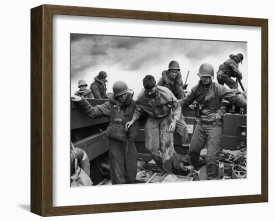 US Coast Guardsmen Assisting a Wounded Marine Returning from the Fight on Iwo Jima-null-Framed Photographic Print