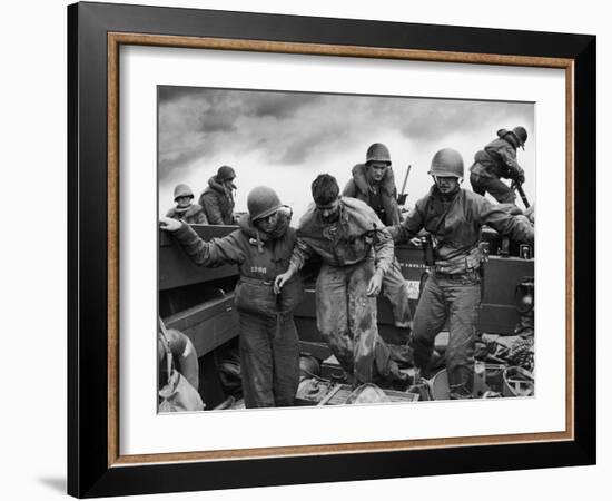 US Coast Guardsmen Assisting a Wounded Marine Returning from the Fight on Iwo Jima-null-Framed Photographic Print