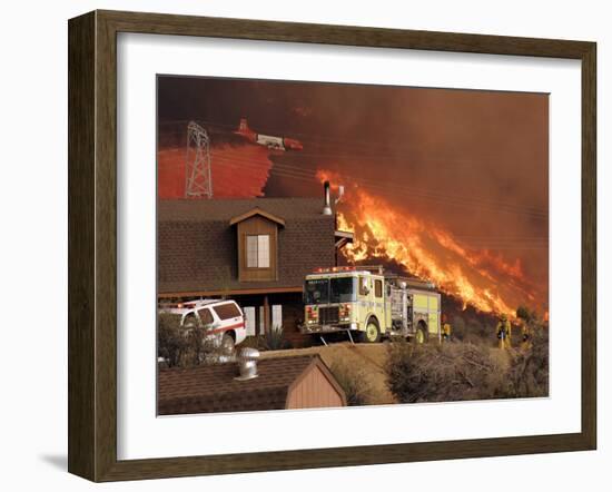 US Forest Service Air Tanker Drops Fire Retardant as the Fire Burns in the Hills Above a Home-null-Framed Photographic Print