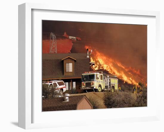 US Forest Service Air Tanker Drops Fire Retardant as the Fire Burns in the Hills Above a Home-null-Framed Photographic Print