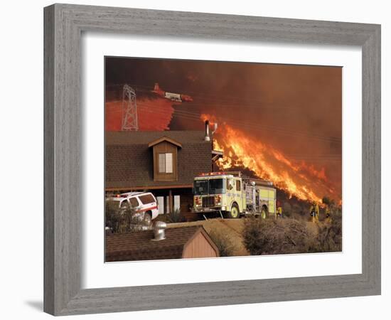 US Forest Service Air Tanker Drops Fire Retardant as the Fire Burns in the Hills Above a Home-null-Framed Photographic Print