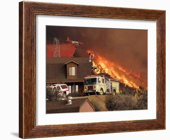 US Forest Service Air Tanker Drops Fire Retardant as the Fire Burns in the Hills Above a Home-null-Framed Photographic Print