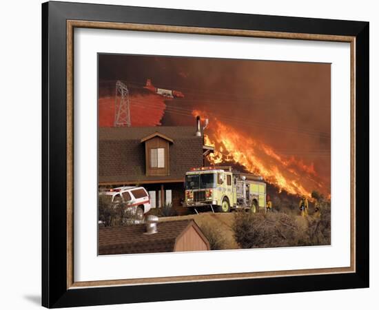 US Forest Service Air Tanker Drops Fire Retardant as the Fire Burns in the Hills Above a Home-null-Framed Photographic Print