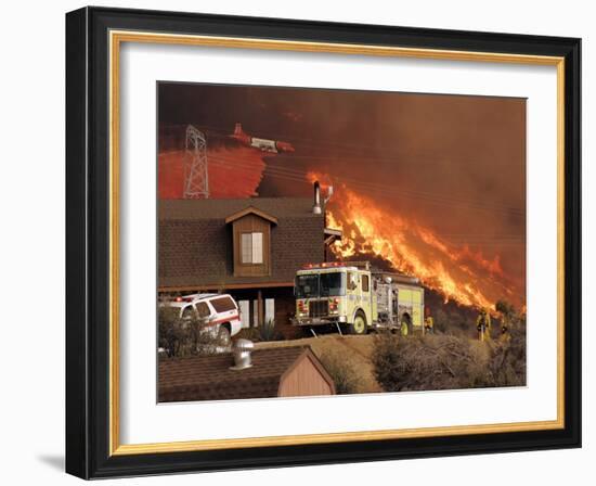 US Forest Service Air Tanker Drops Fire Retardant as the Fire Burns in the Hills Above a Home-null-Framed Photographic Print