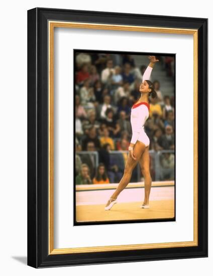 US Gymnast Ludmila Turishcheva Performing a Floor Exercise at the Summer Olympics-John Dominis-Framed Photographic Print