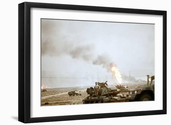 US Marine Following the Retreat of Iraqi Forces from Kuwait, Feb 27, 1991-null-Framed Photo