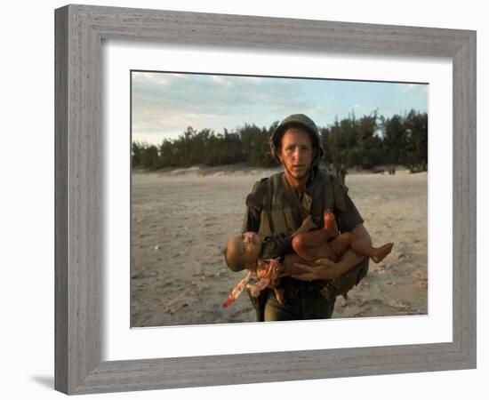 US Marine Holding an Injured Vietnamese Child-Paul Schutzer-Framed Photographic Print