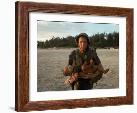 US Marine Holding an Injured Vietnamese Child-Paul Schutzer-Framed Photographic Print