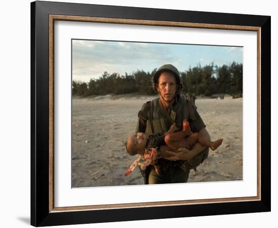 US Marine Holding an Injured Vietnamese Child-Paul Schutzer-Framed Photographic Print
