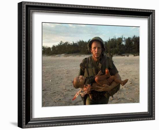 US Marine Holding an Injured Vietnamese Child-Paul Schutzer-Framed Photographic Print