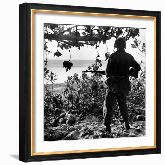 US Marine Looking at Bodies of Dead Japanese Soldiers Killed During Battle For Control of Saipan-W^ Eugene Smith-Framed Photographic Print