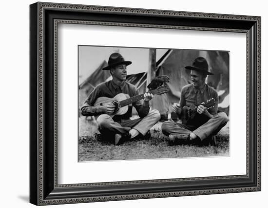 US Marine Sitting on Ground and Playing Guitar-null-Framed Photographic Print