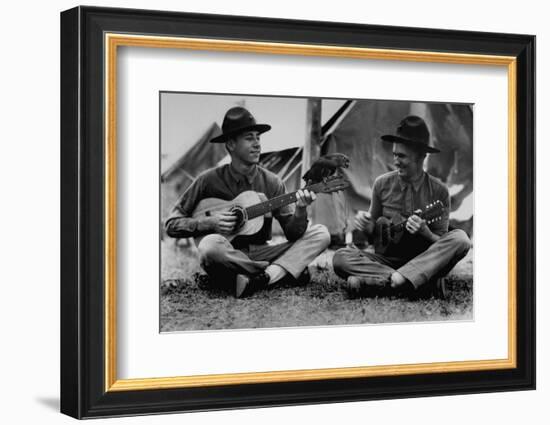 US Marine Sitting on Ground and Playing Guitar-null-Framed Photographic Print