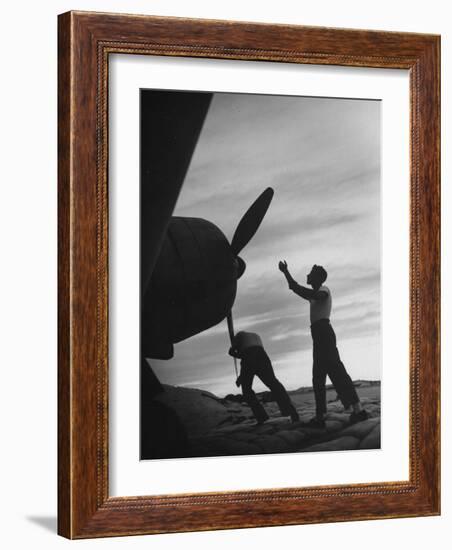 US Marines Pushing Through the Props of Bomber at US Naval Base on Midway Island-Frank Scherschel-Framed Photographic Print