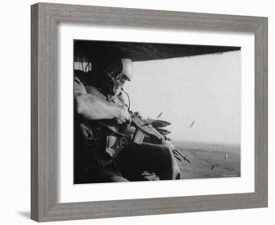 US Military Personnel Firing from Helicopters Onto Viet Cong Targets-Larry Burrows-Framed Photographic Print