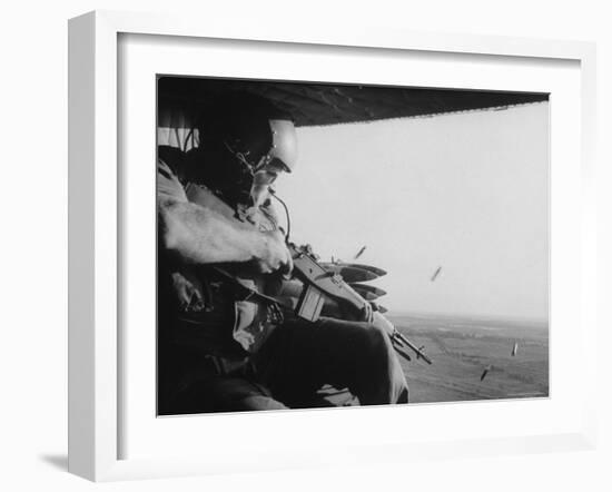 US Military Personnel Firing from Helicopters Onto Viet Cong Targets-Larry Burrows-Framed Photographic Print