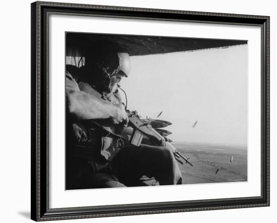 US Military Personnel Firing from Helicopters Onto Viet Cong Targets-Larry Burrows-Framed Photographic Print
