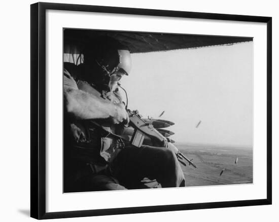 US Military Personnel Firing from Helicopters Onto Viet Cong Targets-Larry Burrows-Framed Photographic Print