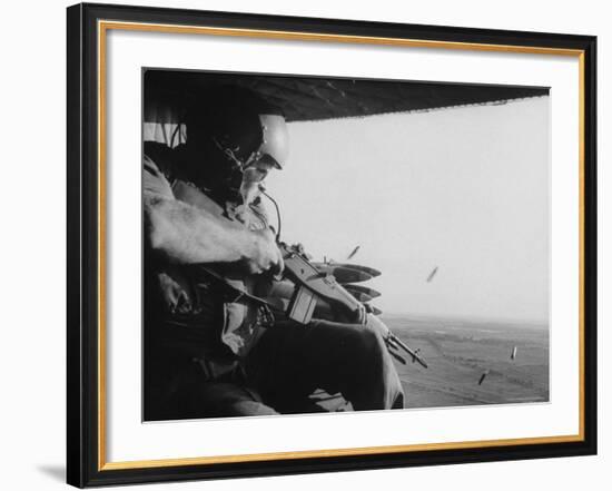 US Military Personnel Firing from Helicopters Onto Viet Cong Targets-Larry Burrows-Framed Photographic Print